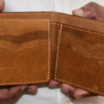 Minimalist golden tan bifold slim wallet designed for efficiency
